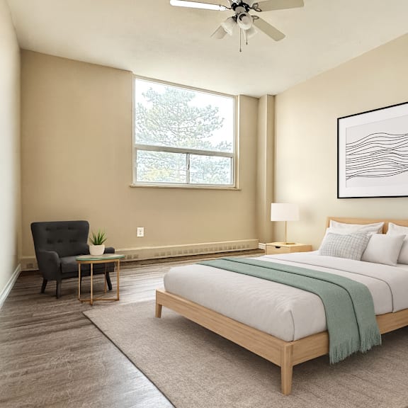 a bedroom with a large bed, a chair, and a ceiling fan.