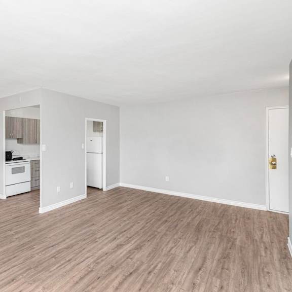 a room with a white wall and a white door.