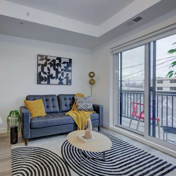 living room with balcony at the maverick apartments, ontario