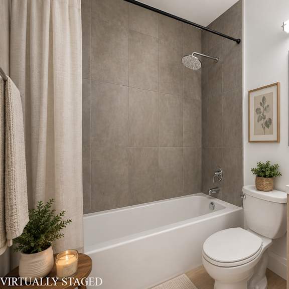 a bathroom with a white toilet, a white sink, and a white bathtub.