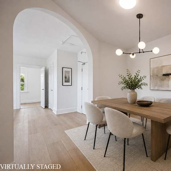 a dining room with a wooden table and chairs.