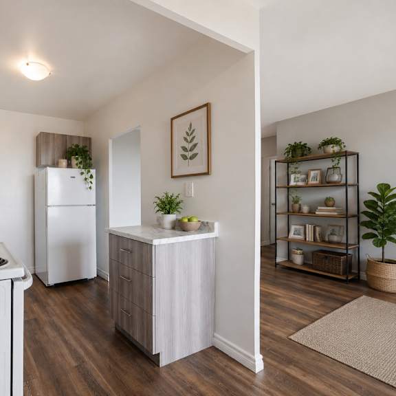a kitchen with a white stove top oven and a white refrigerator.