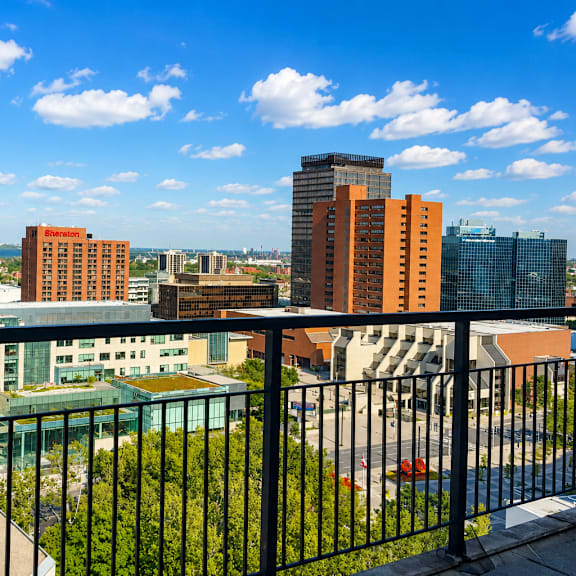 a cityscape with buildings of various heights and a clear blue sky.