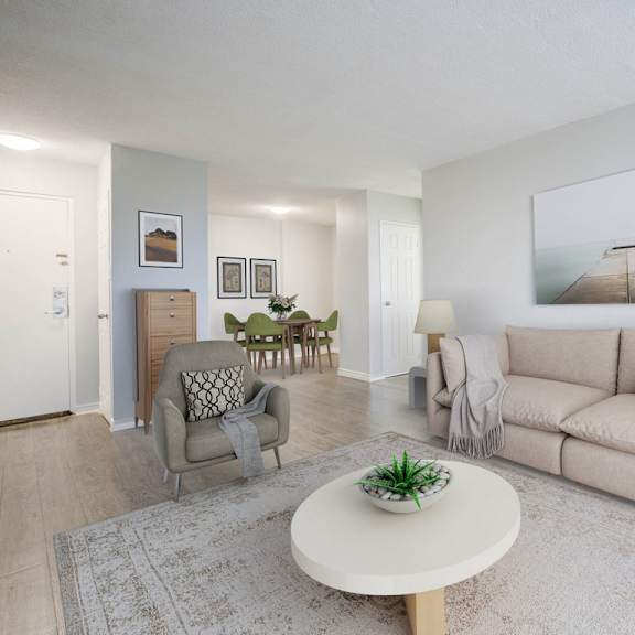 a living room with a couch, chair, and a coffee table.
