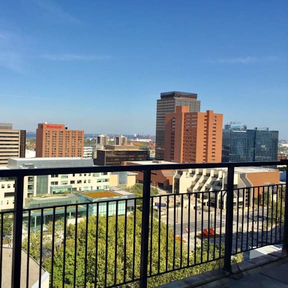 a cityscape with buildings of various heights and a clear blue sky.