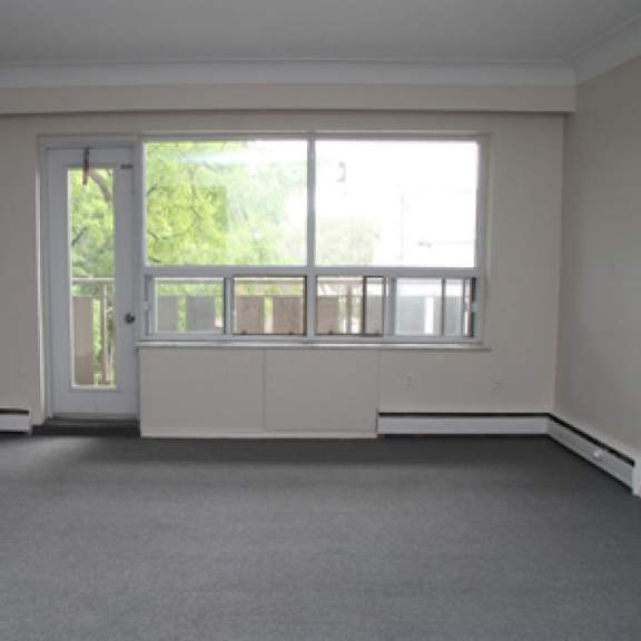 a room with a large window and a door.
