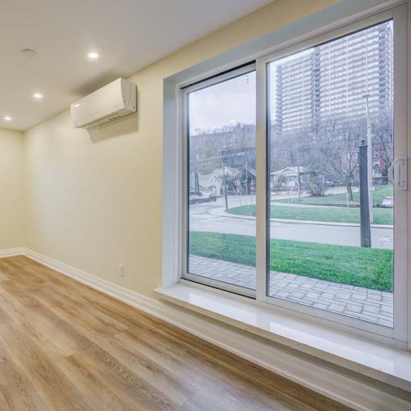 a room with a window and a sliding glass door.