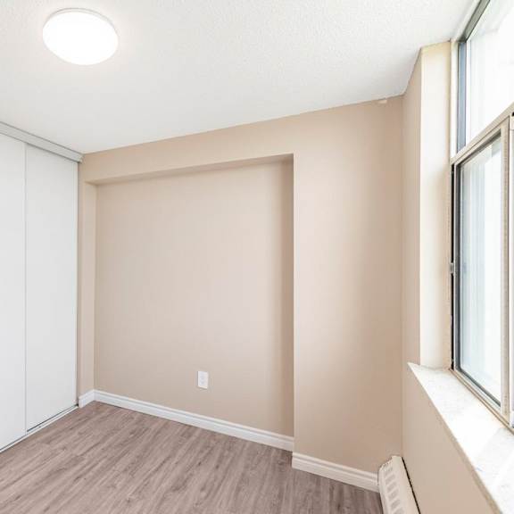 a room with a sliding door and a window.
