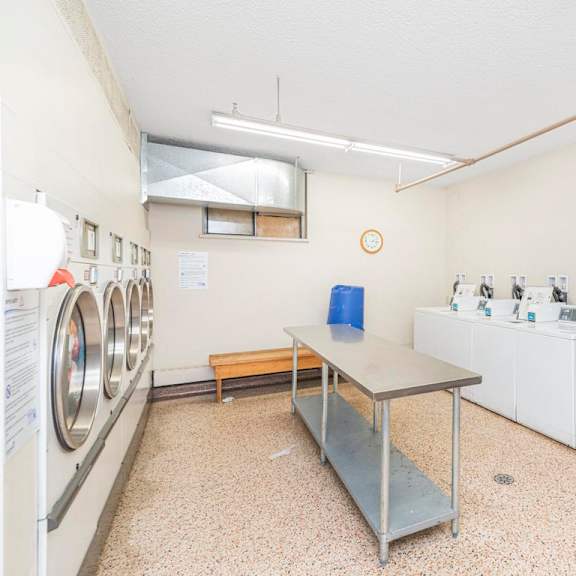 a laundromat with washers and dryers is shown.