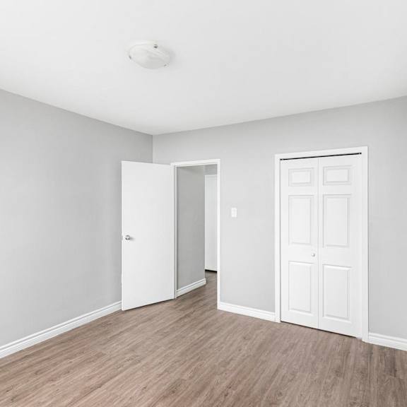 a room with a white door and a white wall.