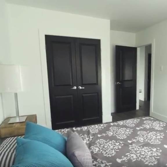 a bedroom with a bed and a dresser.