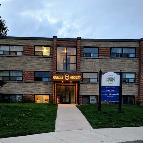 the osler court building is a modern structure with a brick facade and a welcoming entrance.