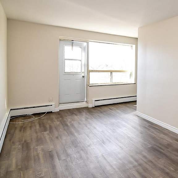 a room with a door and a window.