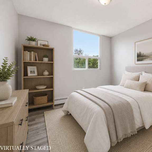 a bedroom with a large bed, a nightstand, and a bookshelf.