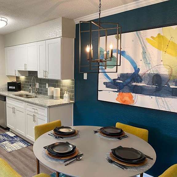 a modern kitchen with a dining table at latitude at riverchase, alabama, 35216