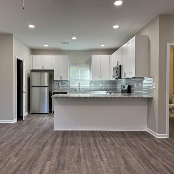 new 3 bedroom kitchen with a countertop and cabinets.