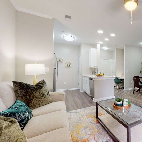 a living room with a couch, coffee table, and a television at embry hills, atlanta, georgia