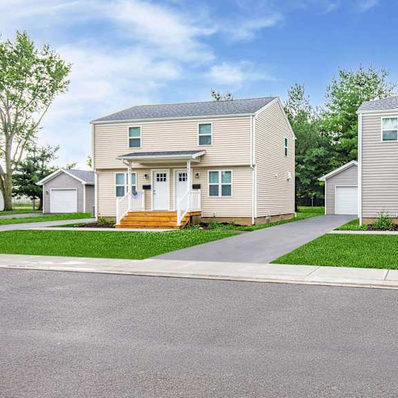 two houses are side by side with a road in between at poplar place apartments, illinois