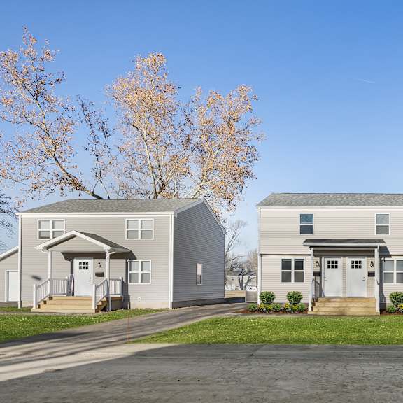 a row of houses with trees in the background at poplar place apartments, springfield, illinois
