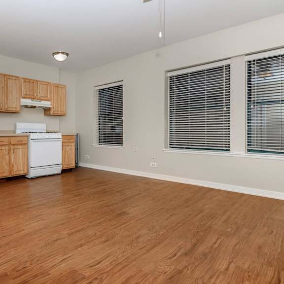 a kitchen with wooden cabinets and a white fridge at sheridan park, chicago, il