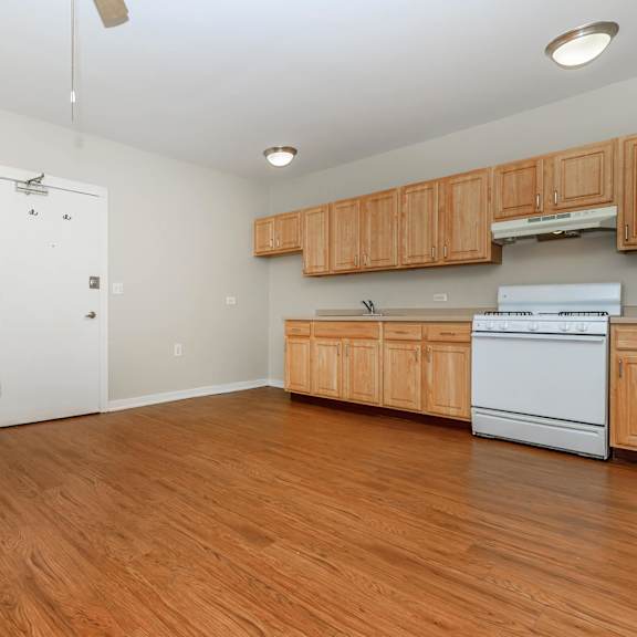 a kitchen with wooden cabinets at sheridan park, chicago