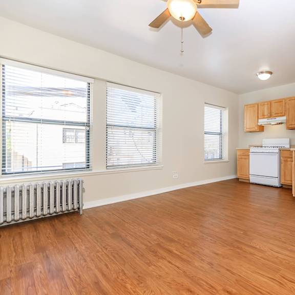 a room with wooden floors and a ceiling fan at sheridan park, chicago, illinois