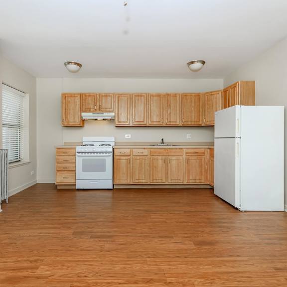 a kitchen with wooden cabinets at sheridan park, chicago, 60640