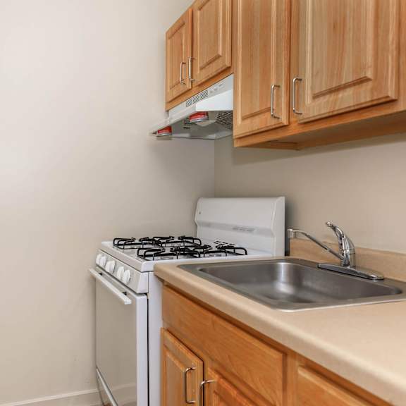 a kitchen with a stove, sink and cabinets at sheridan park, illinois 60640