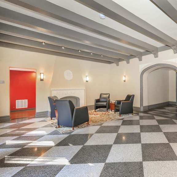 a hallway with a checkered floor and a red door at sheridan park, chicago, il 60640