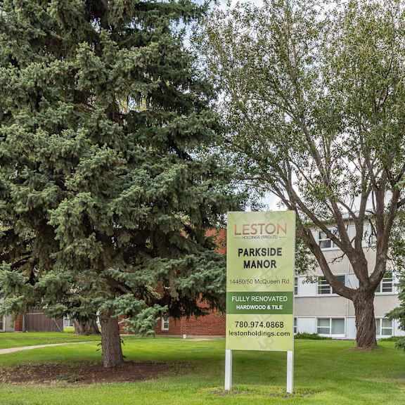 a sign in front of a building that says leston parkside manor.