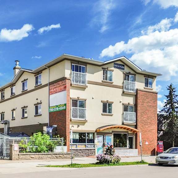 a large building with a sign that says "residences" in front of it.