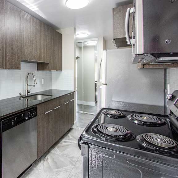a modern kitchen with a stove top oven.