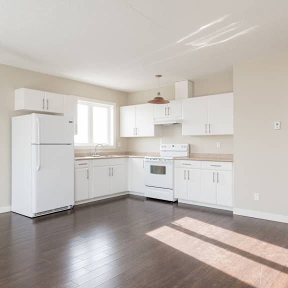 a kitchen with white appliances and cabinets.