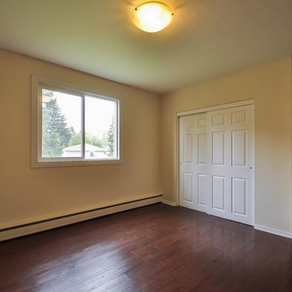 a room with a white door and a window.