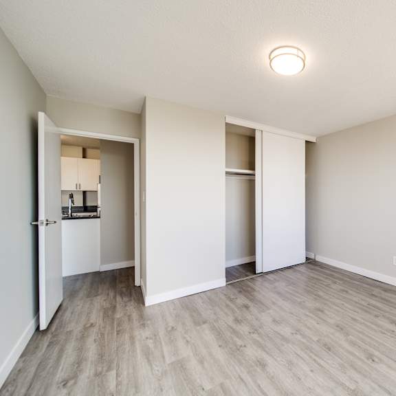 a room with a white ceiling and a light on it.