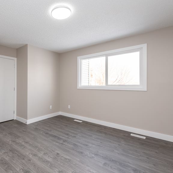 a room with a sliding door and a window.