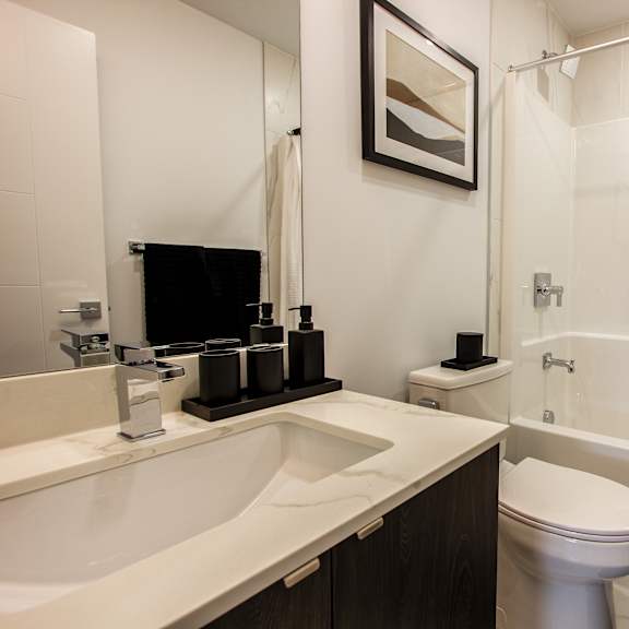 a white sink and toilet in a bathroom.