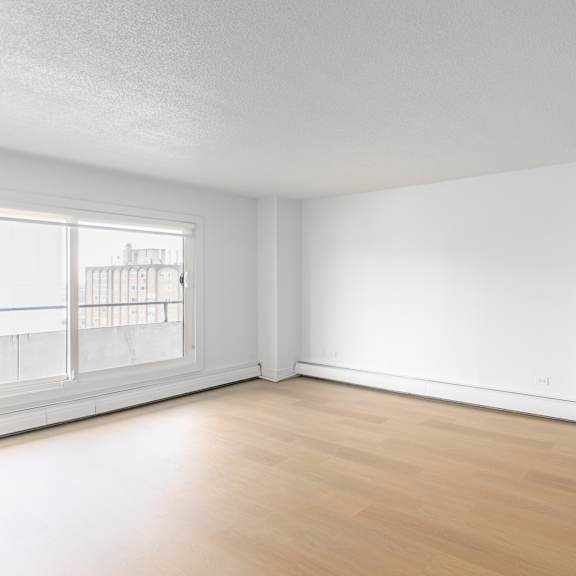 empty room with wooden floor and white walls.