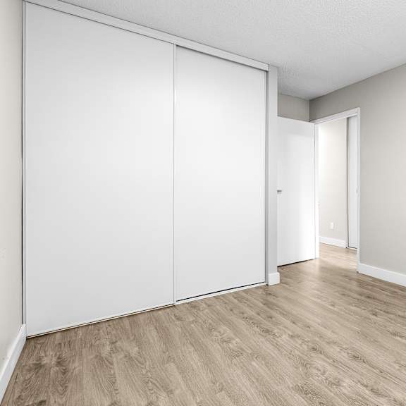 a room with a white door and a white wall.