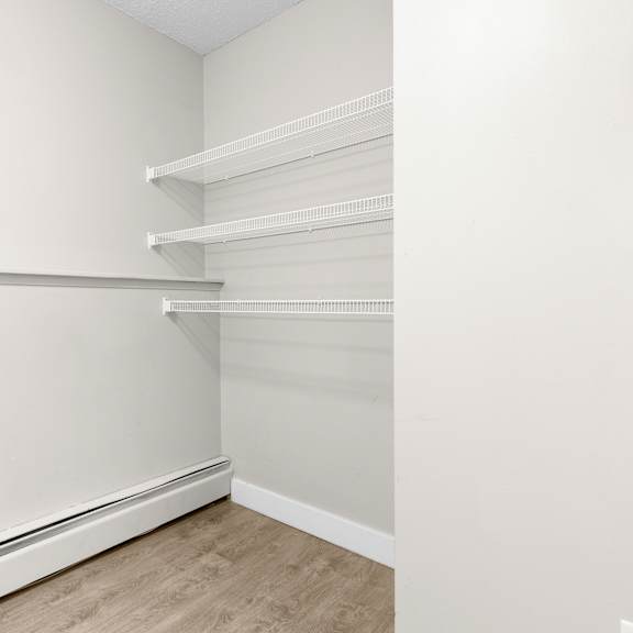 empty room with white walls and wooden floor.
