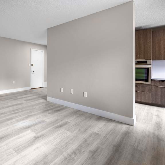 a room with a door and a wall socket.