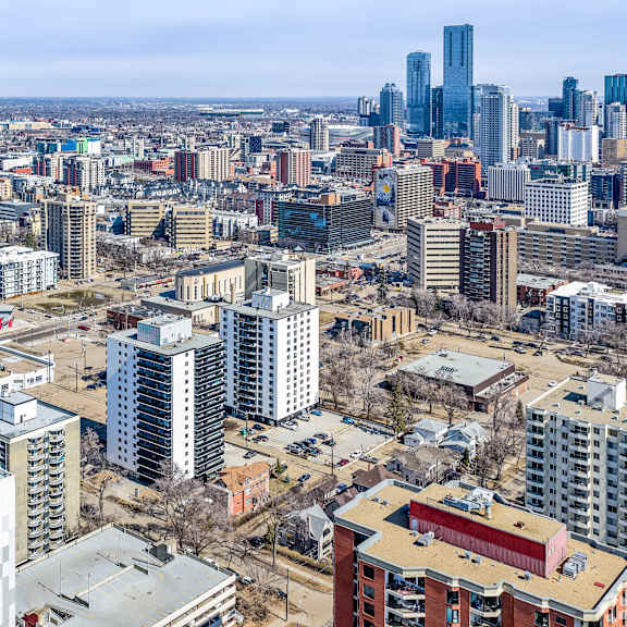 a cityscape with a mix of residential and commercial buildings.