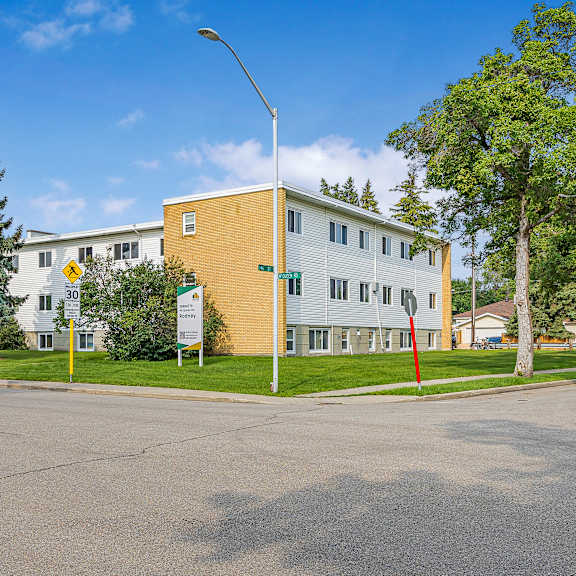 a yellow building with a sign that says 30 on it.