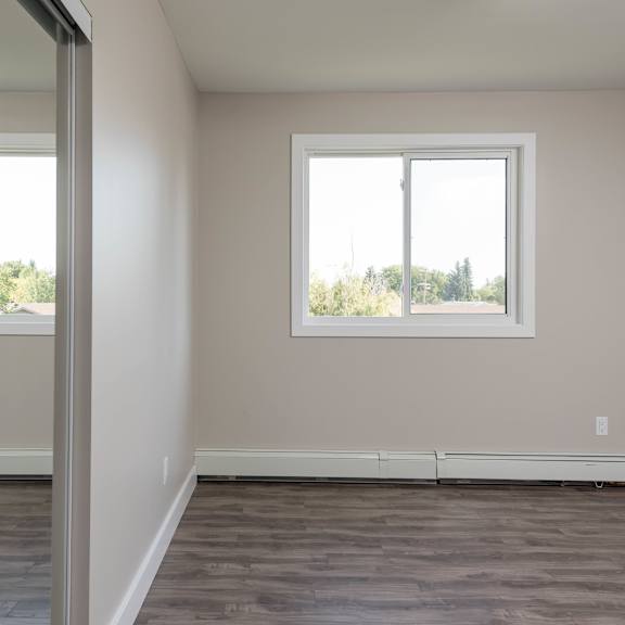 a room with a window and a door.