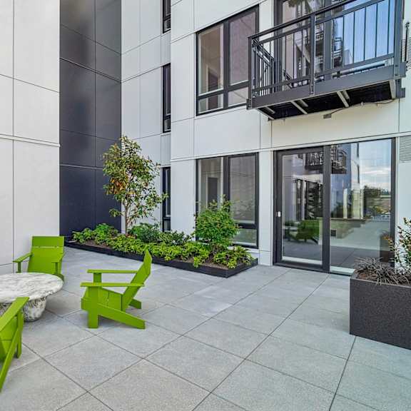 a patio with a table and chairs.