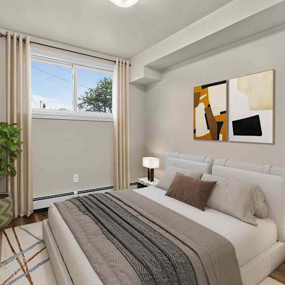 a bedroom with a large bed, a potted plant, and a painting on the wall.