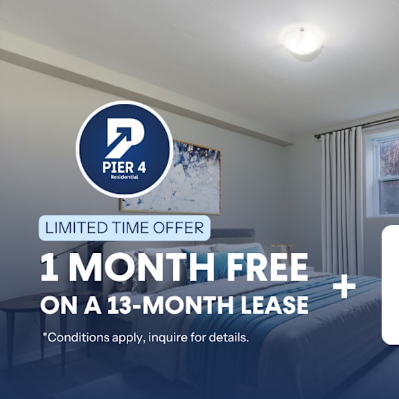 a room with a window and a poster on the wall advertising a limited time offer for a free month on a 13-month lease with a $500 gift card.