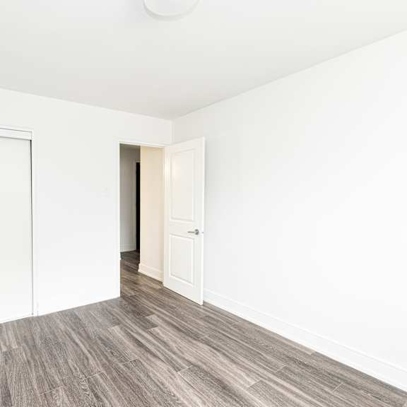 a room with a white door and a white wall.