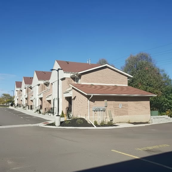 a large building with a parking lot in front of it.