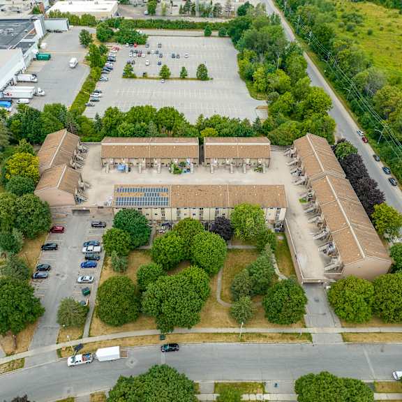a large building with a parking lot in front of it.